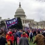 PHOTO BY PHILLIP PINE Protesters stand outside Capitol Hill after attending a pro-Trump rally on Wednesday, Jan. 6.