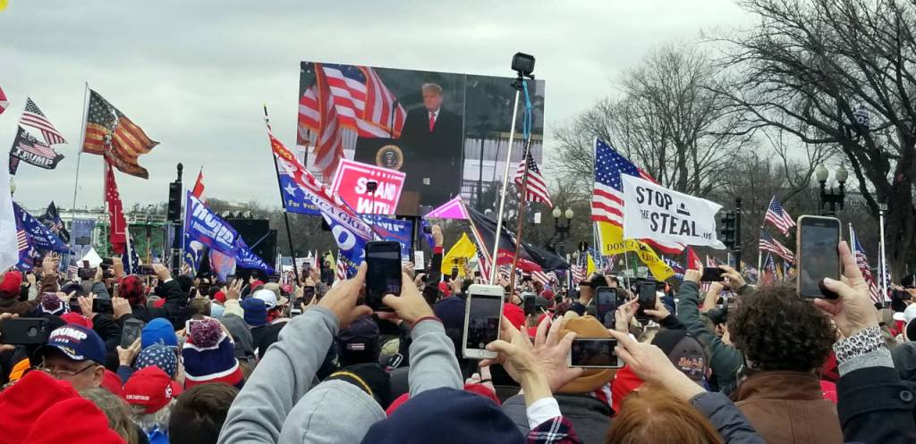 PHOTO BY PHILLIP PINE Attendees watch the President give a speech during a pro-Trump rally on Wednesday, Jan. 6 in Washington D.C.