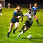 Ocosta defender Maia Soderlund, right, battles with Adna forward Summer White during Ocostas 2-1 loss on Wednesday in Adna. (Eric Trent | The Chronicle)