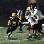 RYAN SPARKS | THE DAILY WORLD Aberdeen running back Connar Sherman, left, carries the football against WF West on Monday in Aberdeen.