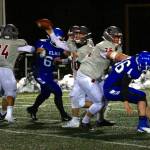 RYAN SPARKS | THE DAILY WORLD Hoquiam quarterback Dane McMillan, middle, makes a pass during the Grizzlies 27-13 loss to Elma on Monday in Montesano.