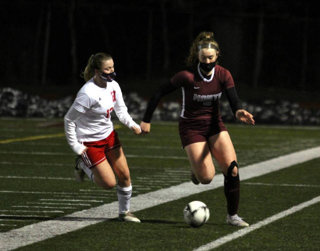 Montesanos Paige Lisherness, right, dribbles against Hoquiams Alyssa Perry during a game on Tuesday, Feb. 16 at Jack Rottle Field in Montesano. (Photo by Ben Winkelman)
