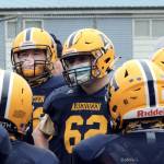 Aberdeen football players commiserate during a team meeting before leaving to play Black Hills on Saturday. The Bobcats lost 7-0. (Photo by Ben Winkelman)