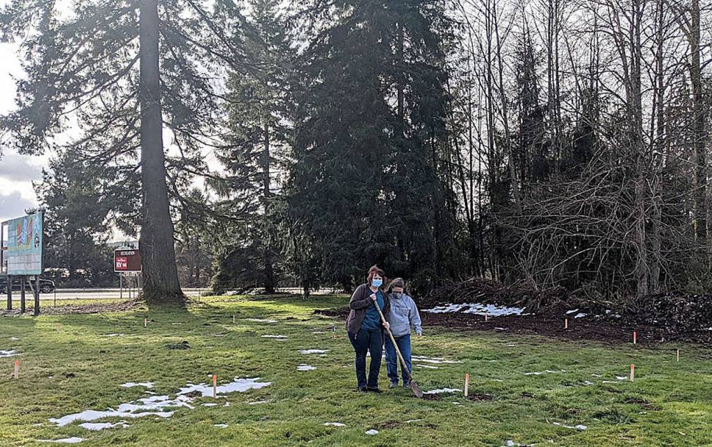 (Photo by Dave Haviland) Drs. Sonnya Wilkins, left, and Corrie Hines pose on the ground they're planning for a new facility for wounded raptors, just outside Montesano.
