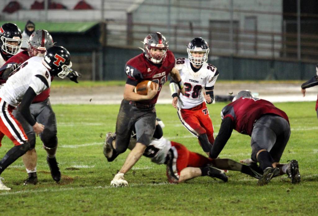 Hoquiam running back Troy McMinn carries the ball during the Grizzlies 12-0 win over Tenino on Friday at Olympic Stadium in Hoquiam. (Photo by Ben Winkelman)