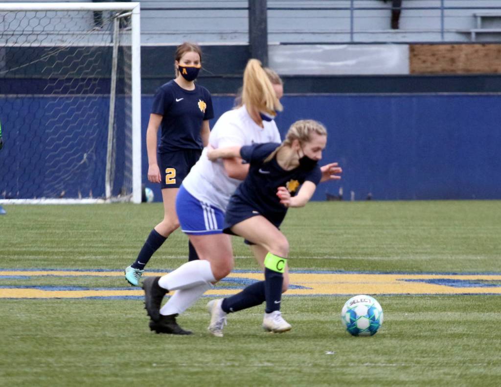 Aberdeen senior midfielder Emma Green (right) jostles for possession with Rochesters Kaylei Clark during the Bobcats 2-0 win on Saturday in Aberdeen. (Ryan Sparks | The Daily World)