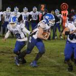 Elma running back Conan Baxter (40) receives a hand-off from quarterback René Duran during Elmas 32-8 victory over Hoquiam on Friday in Hoquiam. (Ryan Sparks | The Daily World)