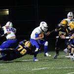 Rochester quarterback Parker Mcaferty (10) is chased by Seth Brown (78) and the Aberdeen defense during Saturdays game at Stewart Field in Aberdeen. (Ryan Spark | The Daily World)
