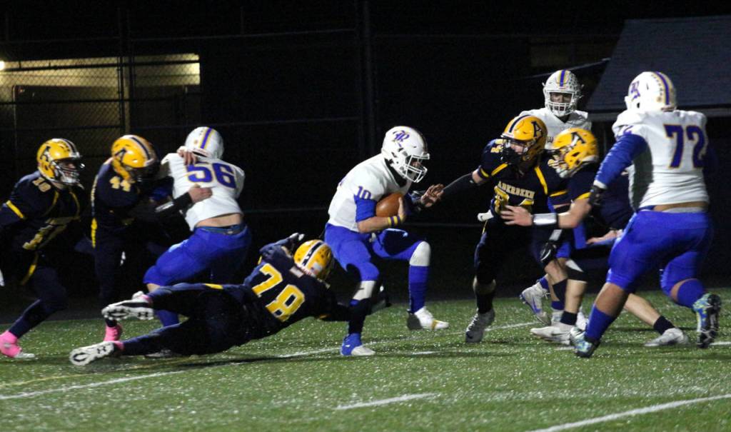 Rochester quarterback Parker Mcaferty (10) is chased by Seth Brown (78) and the Aberdeen defense during Saturdays game at Stewart Field in Aberdeen. (Ryan Spark | The Daily World)