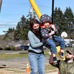 DAN HAMMOCK | THE DAILY WORLD 
The new playground equipment at Garley Park in south Aberdeen was getting a workout on a warm, sunny afternoon Thursday. Jessica Byers brought her 5-year-old son, Tyr, and 3-year-old daughter, Ava; they both took turns on the zip line, getting an assist from Josh White and Ashley Byers, both of Westport. Ava later took a whack at the adjacent climbing wall, with White providing a boost.
