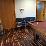 DAVE HAVILAND | THE DAILY WORLD 
A pool table and chairs in the common area of the shelter.
