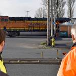 photos by DAN HAMMOCK / THE DAILY WORLD 
Aberdeen City Engineer Kris Koski, left, and Sen. Jeff Wilson watch a train cross South Newell Street in east Aberdeen Tuesday morning. Wilson was in town to get an update on the east Aberdeen rail separation project.