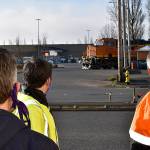 DAN HAMMOCK | THE DAILY WORLD 
A train crosses South Newell Street in east Aberdeen Tuesday morning. From left, Hoquiam City Administrator Brian Shay, Aberdeen City Engineer Kris Koski, and Sen. Jeff Wilson, talk about the east Aberdeen rail separation project.