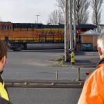 photos by DAN HAMMOCK / THE DAILY WORLD 
Aberdeen City Engineer Kris Koski, left, and Sen. Jeff Wilson watch a train cross South Newell Street in east Aberdeen Tuesday morning. Wilson was in town to get an update on the east Aberdeen rail separation project.