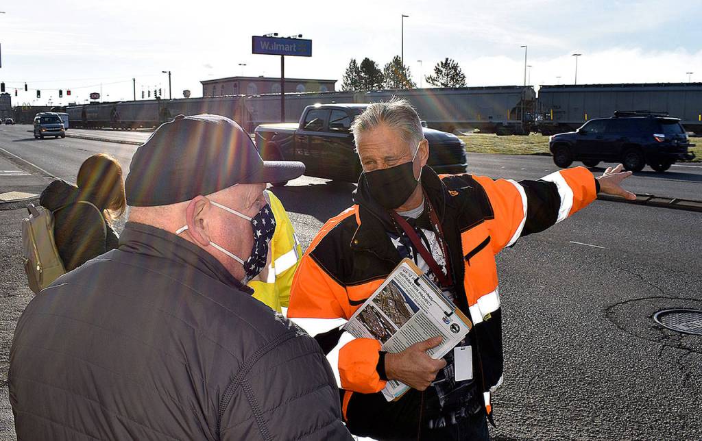 Aberdeen Mayor Pete Schave, left, and Sen. Jeff Wilson stand at the corner of South Newell Street and Highway 12 in east Aberdeen Tuesday morning, discussing the east Aberdeen rail separation project.