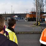 DAN HAMMOCK | THE DAILY WORLD 
A train crosses South Newell Street in east Aberdeen Tuesday morning. From left, Hoquiam City Administrator Brian Shay, Aberdeen City Engineer Kris Koski, and Sen. Jeff Wilson, talk about the east Aberdeen rail separation project.