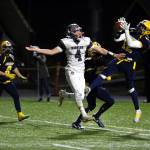 PHOTO BY BEN WINKELMAN Aberdeen defensive back Jakob Bowers, right, intercepts a pass in front of Hoquiam receiver Abraham Morales during Saturdays game at Stewart Field in Aberdeen.