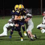 RYAN SPARKS | THE DAILY WORLD Aberdeen running back Jeremy Sawyer (20) carries Hoquiam defenders on a run in the second half of Saturdays game in Aberdeen. Sawyer finished the game with 214 yards and three touchdowns.