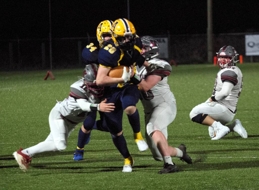 RYAN SPARKS | THE DAILY WORLD Aberdeen running back Jeremy Sawyer (20) carries Hoquiam defenders on a run in the second half of Saturdays game in Aberdeen. Sawyer finished the game with 214 yards and three touchdowns.