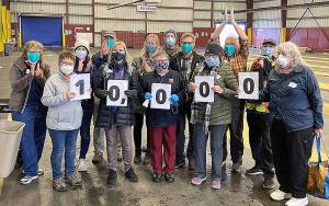 COURTESY GRAYS HARBOR COUNTY PUBLIC HEALTH
Volunteers at the mass vaccination site at the Port of Grays Harbor celebrated a milestone Friday, when the 10,000th dose of COVID-19 vaccine was administered. Since it opened in mid-February, the site has delivered more than one-third of the just shy of 29,000 total doses delivered so far in the county. Pictured from left are Louise Baxter, Sharilyn Everitt, Stephanie Gundersen, David Everitt, Liane Aigner, Renee Dagnen, Judy Ford, Charles Troutman, Ryan Aigner, Janice Nations, Jean Anderson, Walt Pullar, and Anne Marie Sheppard.