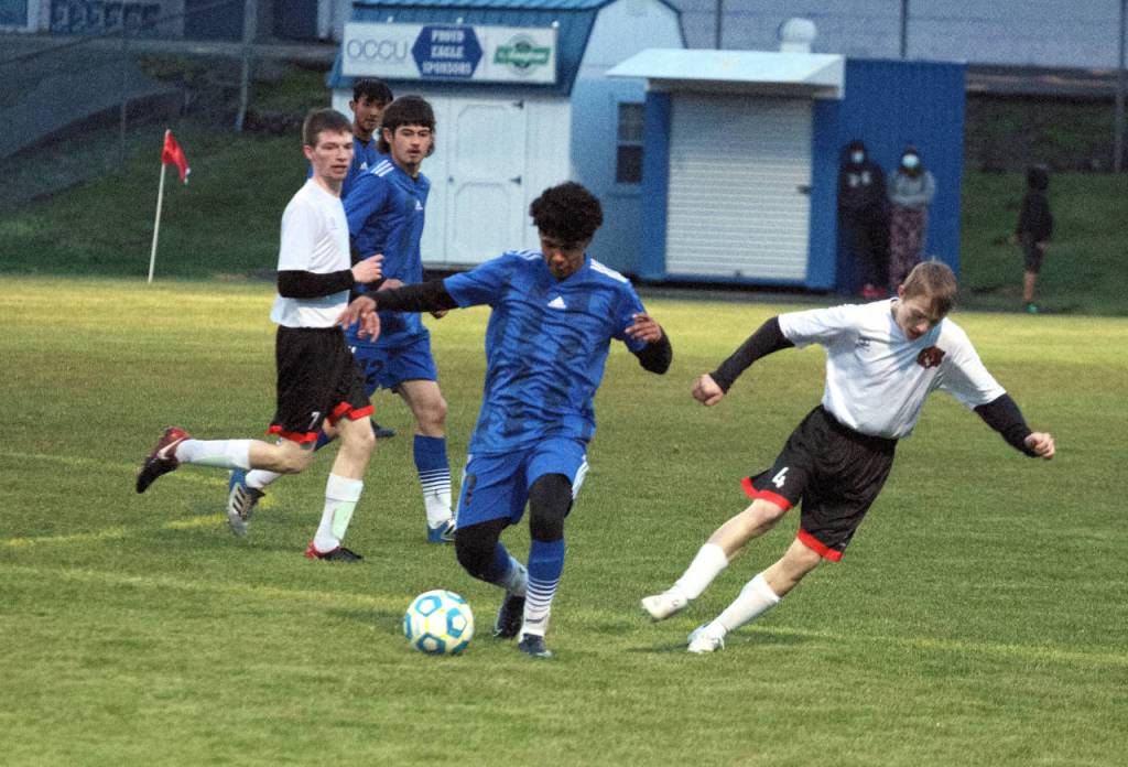Elmas Rodrigo Luna dribbles against the Tenino defense during Elmas 7-0 win on Wednesday in Elma. (Ryan Sparks | The Daily World)