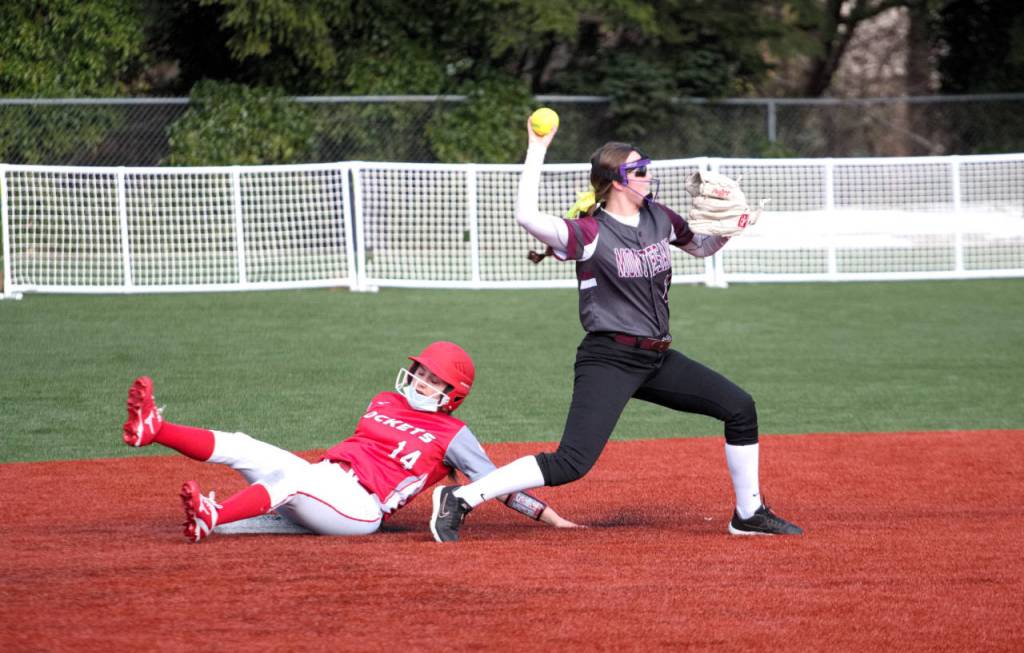 Montesano infielder Cassadie Golding, right, attempts to turn a double play after recording the put out of Castle Rocks Gracie Kimball during the Bulldogs 14-11 win on Tuesday at Montesano High School. (Ryan Sparks | The Daily World)
