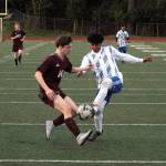 RYAN SPARKS | THE DAILY WORLD Montesanos Cole Ekerson (14) and Elmas Rodrigo Luna battle for possession during Elmas 3-0 victory on Wednesday at Jack Rottle Field in Montesano.