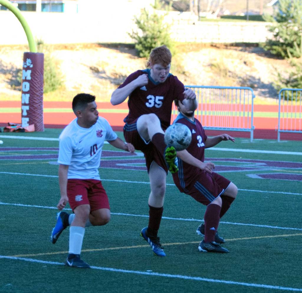 RYAN SPARKS | THE DAILY WORLD
Montesano's Jered Whisenhunt (35) gets a touch on the ball while being pursued by Hoquiam's Cavan Estrada during the Bulldogs 1-0 victory on Thursday in Montesano.