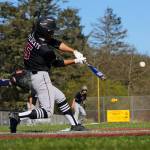 PHOTO BY ROB HILSON Ocostas Harley Figueroa belts and RBI single to center field during Ocostas 13-9 loss to Ilwaco on Friday in Long Beach.