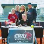 PHOTO BY SHAWN DONNELLY Montesano softball player Jessica Stanfield, sitting, signed a Letter of Intent to play for Central Washington University in the fall, joining her older sister, Samantha, on the Wildcats roster. Stanfield is joined by (from left) sister Alexa Stanfield, sister and Montesano teammate Mikayla Stanfield, mother Julie Stanfield and father Eric Stanfield.