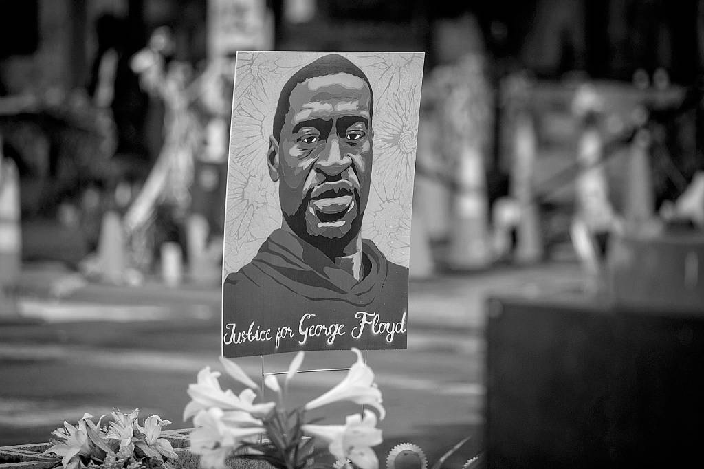 Images of George Floyd are placed all around the area surrounding Cup Foods, where Floyd was killed in Minneapolis. (Jason Armond/Los Angeles Times/TNS)
