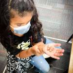 (Photo by North Beach School District) Pacific Beach Elementary student with butterfly.
