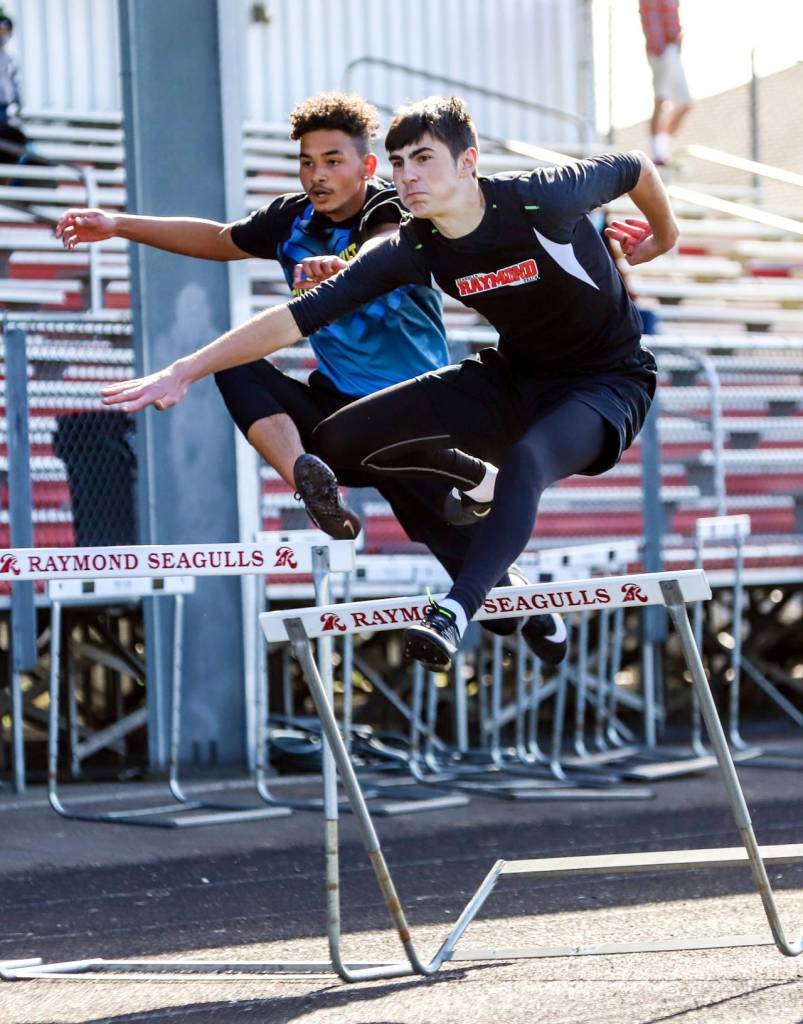 PHOTO BY LARRY BALE Raymonds Morgan Anderson, right, races during the 110 meter hurdles at the 2B Pacific League Championship Meet on Thursday in Raymond.
PHOTO BY LARRY BALE Raymonds Morgan Anderson, right, races during the 110 meter hurdles at the 2B Pacific League Championship Meet on Thursday in Raymond.