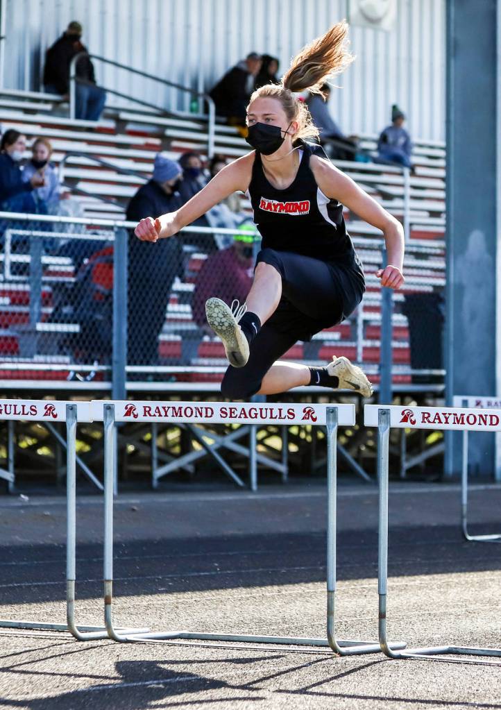 PHOTO BY LARRY BALE Raymonds Kyra Gardner won the girls 100 meter hurdles (pictured), the long jump and triple jump at the 2B Pacific League Championship Meet on Thursday in Raymond.