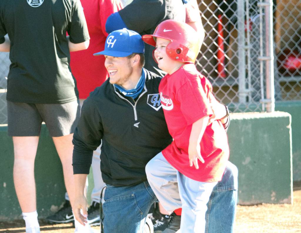 RYAN SPARKS | THE DAILY WORLD Grays Harbor College baseball player Tysen Richardson, an Elma High School graduate, and shares some smiles and laughs with Challenger Division player Scottland Ballew during Mondays game in Montesano.