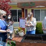 DAVE HAVILAND THE DAILY WORLD 
From left to right, Eldergrow Program Administrator Catherine Booth explains some of the procedures to Director of Therapy Bobbie Cheville, and Administrator and Marketing Director Stacie Leach.