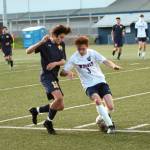 RYAN SPARKS | THE DAILY WORLD Aberdeens Carlos Mendoza (12) gets past Black Hills Zak Gilal during the first half of the Bobcats 4-0 win in a 2A District 4 Tournament game on Saturday at Stewart Field in Aberdeen.