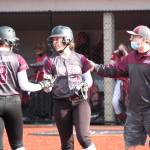 RYAN SPARKS | THE DAILY WORLD Montesano first baseman Grace Geer (8) and shortstop Zoee Lisherness (8) were both named to the 1A Evergreen League First Team on Thursday. The two are pictured with Montesano head coach Pat Pace during a game against Castle Rock in March.