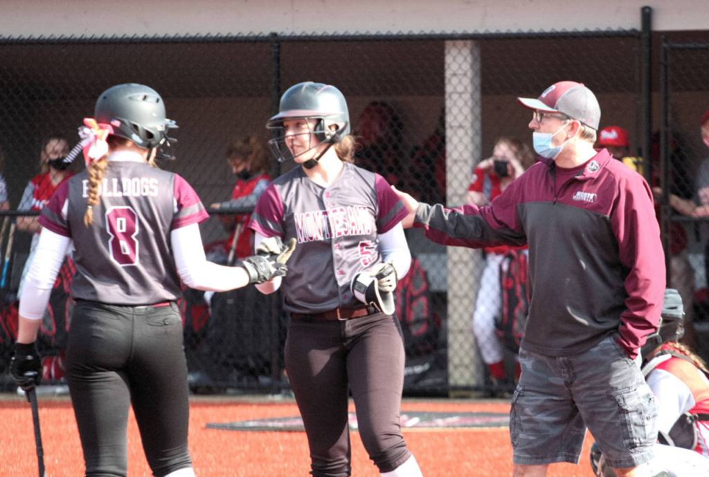 RYAN SPARKS | THE DAILY WORLD Montesano first baseman Grace Geer (8) and shortstop Zoee Lisherness (8) were both named to the 1A Evergreen League First Team on Thursday. The two are pictured with Montesano head coach Pat Pace during a game against Castle Rock in March.