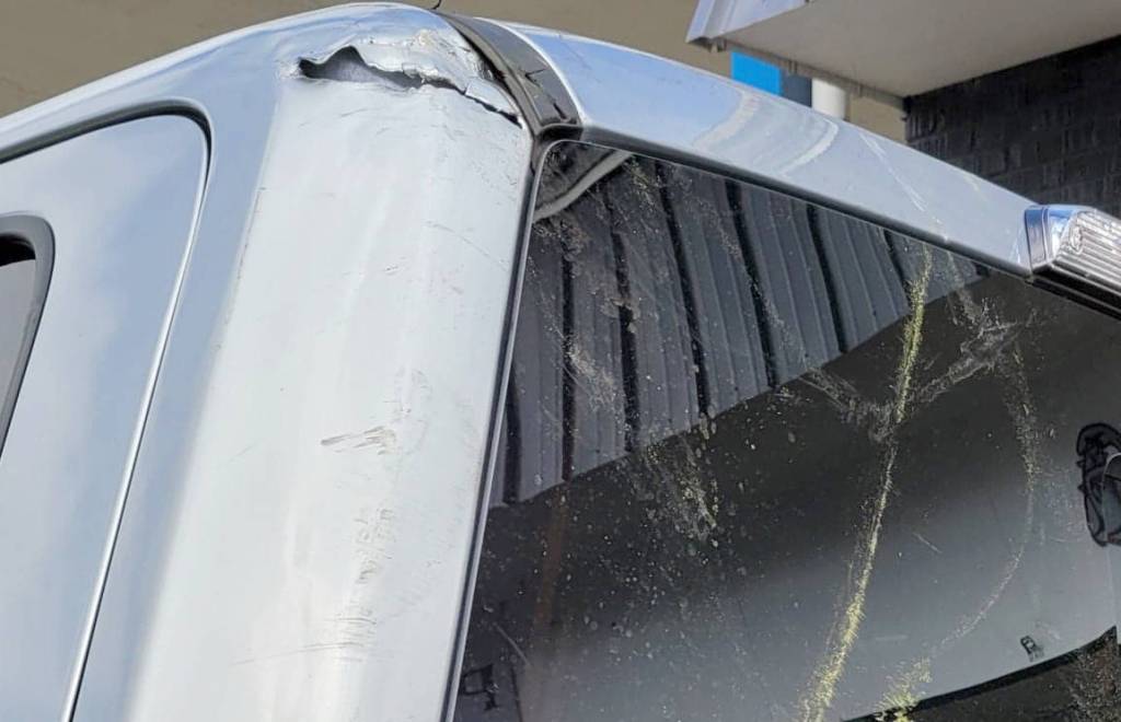 Damaged vehicle that was struck by the downed line. Photo by Debora Wood of Price & Price Real Estate