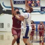 RYAN SPARKS | THE DAILY WORLD Hoquiams Abraham Morales (4) is defended by Elmas Nick Church during Hoquiams 66-63 season-opening overtime victory on Friday in Elma.