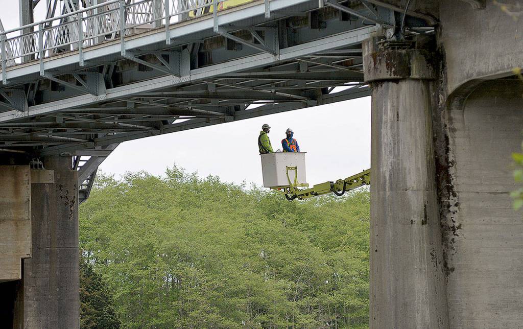 DAVE HAVILAND | THE DAILY WORLD 
Two days of inspection on the Simpson Avenue Bridge in Hoquiam began Monday. The bridge was closed between 9 a.m. and 2 p.m. Monday and will be again Tuesday as crews use a special under-bridge inspection truck to check out the condition of the movable structure.