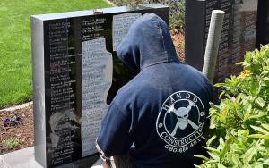 DAN HAMMOCK | THE DAILY WORLD 
Josh Warness with Grays Harbor Monument removes the stencil after engraving 22 new names into the Marion J. Bogey Bogdanovich Veterans Honor Wall in Montesano Thursday.