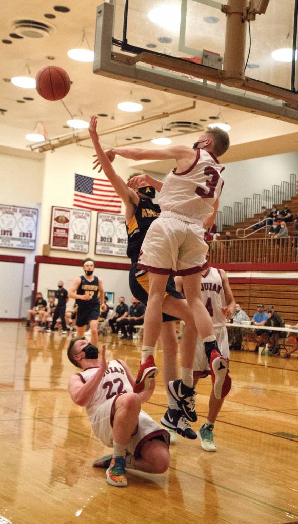RYAN SPARKS | THE DAILY WORLD Hoquiams Michael Lorton-Watkins (3) blocks the shot of Aberdeens Andrew Troeh during the Bobcats 55-43 win on Thursday at Hoquiam Square Garden in Hoquiam.