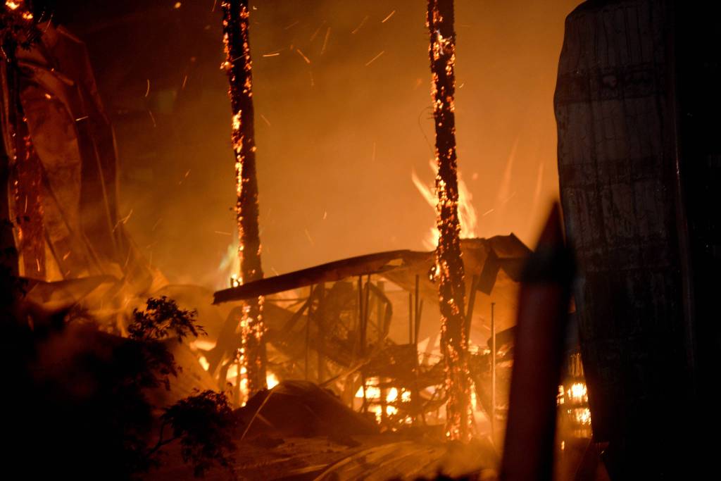 DAVE HAVILAND | THE DAILY WORLD
Fire destroys the spirit production building for Ocean’s Daughter Distillery, a subsidiary of Westport Winery