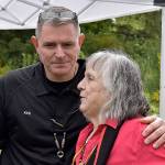 DAN HAMMOCK / THE DAILY WORLD 
Ken Ufkin, Shoalwater Bay Tribe Emergency Management Director, and his predecessor Lee Shipman embrace after Mondays groundbreaking ceremony for the tribes tsunami evacuation tower. The necklace around Ufkins neck was presented to him by Shipman at the conclusion of the ceremony.