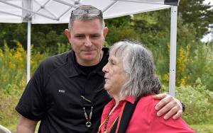 DAN HAMMOCK / THE DAILY WORLD 
Ken Ufkin, Shoalwater Bay Tribe Emergency Management Director, and his predecessor Lee Shipman embrace after Mondays groundbreaking ceremony for the tribes tsunami evacuation tower. The necklace around Ufkins neck was presented to him by Shipman at the conclusion of the ceremony.