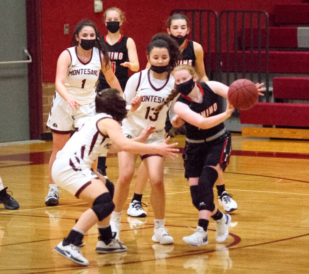 RYAN SPARKS | THE DAILY WORLD 
Montesano defenders Maia Young (13) and Jaiden King hound Tenino guard Abby Severse during Tuesdays game in Montesano. The Bulldogs outscored Tenino 32-16 in the second half to run away with a 57-43 victory.