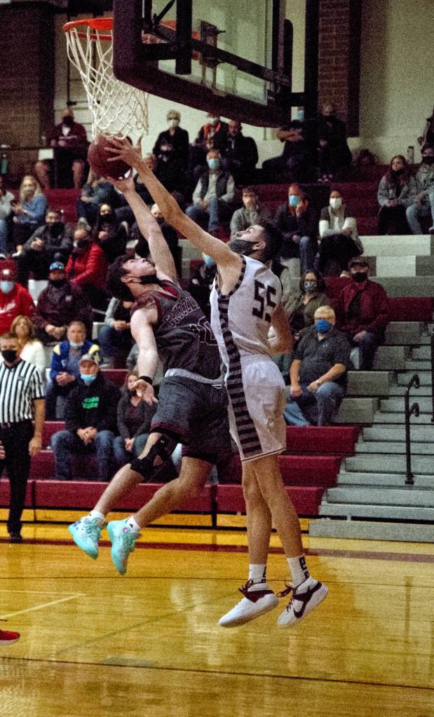 RYAN SPARKS | THE DAILY WORLD Hoquiams Dane McMillan (10) goes up for a shot against Montesanos Mason Dineen (55) during Fridays game at Bo Griffith Memorial Gymnasium in Montesano.