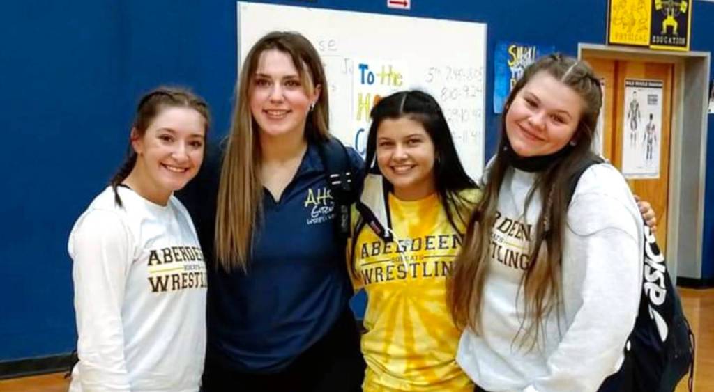 SUBMITTED PHOTO 
Aberdeen senior wrestlers (from left) Katlynn Smith, Tatum Heikkila, Ashlyn Yakovich and Justice Valenzuela pose for a photo after the Bobcats dominated WF West in a dual meet on Thursday, winning 13 of 17 matches against the rival Bearcats.